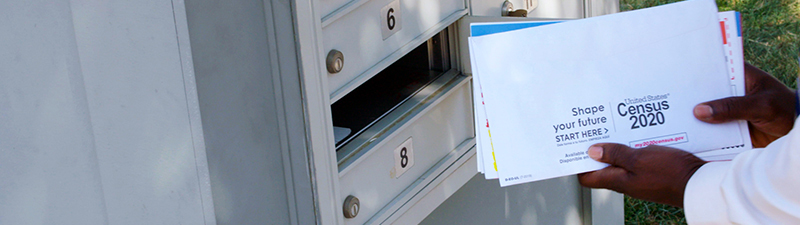 Census being put into a mailbox