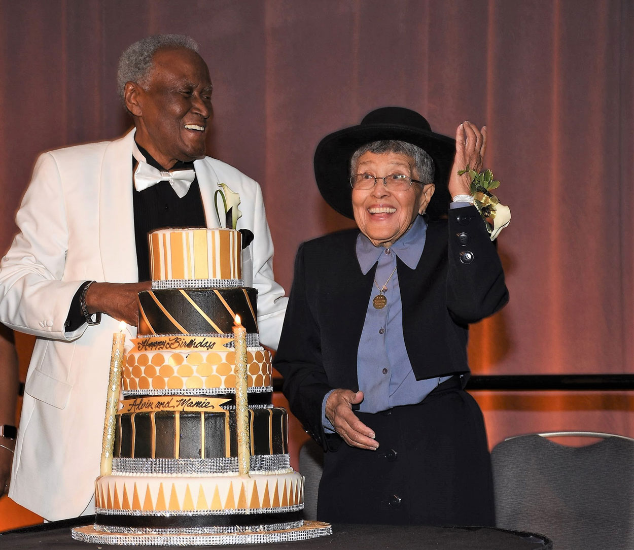 Alvin Brooks and Mamie Hughes share a birthday cake