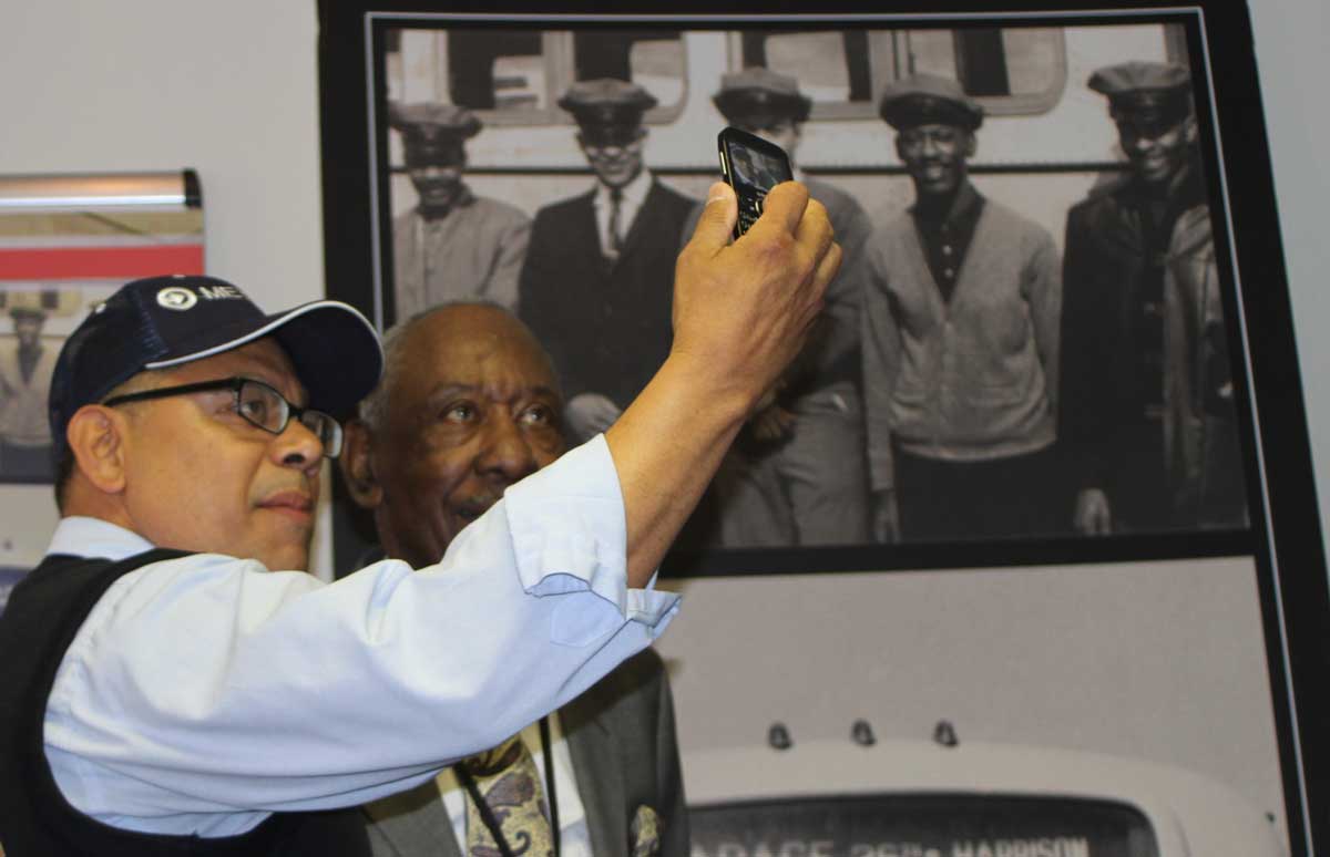 A bus operator takes a selfie with Ray Harris.