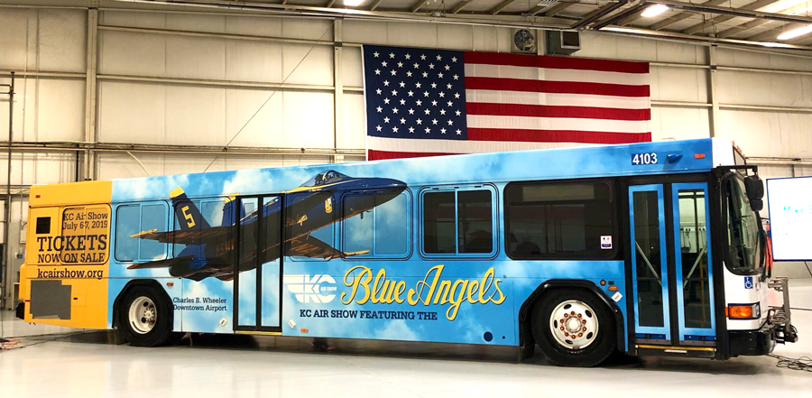 Bus with KC Air Show advertisement, showing the Blue Angels